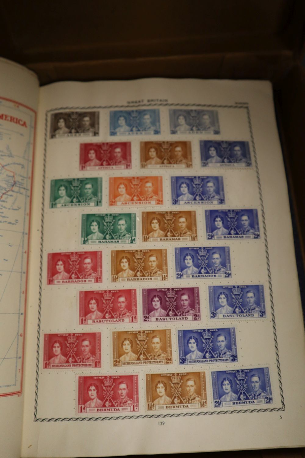 A Triumph Album containing a small collection of GB and World stamps